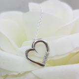 0.15 Carat (ctw) 10K White Gold 3 Stone Lab Grown Diamond Heart Shape Pendant