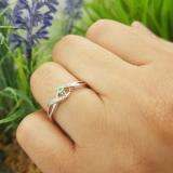0.06 Carat (ctw) Sterling Silver Round Green Emerald & White Diamond Ladies Crossover Swirl Bridal Promise Engagement Ring