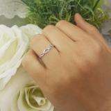 0.10 Carat (ctw) 10K White Gold Round Cut Pink Sapphire Ladies Bridal Anniversary Wedding Band Stackable Swirl Ring