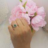 1.45 Carat (ctw) 18K White Gold Oval Cut Emerald & Round Cut White Diamond Ladies Bridal Halo Style Engagement Ring 1 1/2 CT
