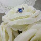 1.45 Carat (ctw) 14K White Gold Oval Cut Tanzanite & Round Cut White Diamond Ladies Bridal Halo Style Engagement Ring 1 1/2 CT