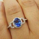 1.45 Carat (ctw) 14K White Gold Oval Cut Tanzanite & Round Cut White Diamond Ladies Bridal Halo Style Engagement Ring 1 1/2 CT