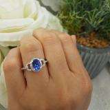 1.45 Carat (ctw) 14K White Gold Oval Cut Tanzanite & Round Cut White Diamond Ladies Bridal Halo Style Engagement Ring 1 1/2 CT