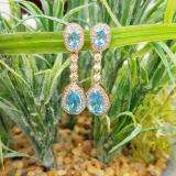 2.65 Carat (ctw) 14K Rose Gold Pear & Oval Cut Blue Topaz & Round Cut White Sapphire & White Diamond Ladies Halo Style Dangling Drop Earrings