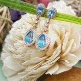 2.65 Carat (ctw) 14K Rose Gold Pear & Oval Cut Blue Topaz & Round Cut White Sapphire & White Diamond Ladies Halo Style Dangling Drop Earrings