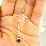 0.60 Carat (ctw) 14K White Gold Heart Cut Garnet & Round Cut White Diamond Ladies Heart Pendant