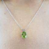 1.50 Carat (ctw) Sterling Silver Oval Cut Peridot Ladies Solitaire Pendant (Chain Included) 1 1/2 CT