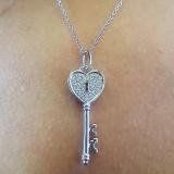 0.18 Carat (ctw) 10k White Gold Round Diamond Ladies Heart Key Pendant