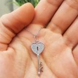 0.18 Carat (ctw) 10k White Gold Round Diamond Ladies Heart Key Pendant
