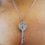 0.18 Carat (ctw) 10k White Gold Round Diamond Ladies Heart Key Pendant