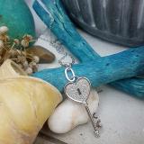 0.18 Carat (ctw) 10k White Gold Round Diamond Ladies Heart Key Pendant