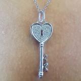 0.18 Carat (ctw) 10k White Gold Round Diamond Ladies Heart Key Pendant