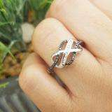 0.25 Carat (ctw) Sterling Silver Round & Baguette Cut Black & White Diamond Ladies Swirl Infinity Wedding Ring 1/4 CT