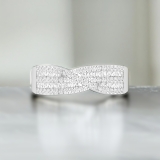 0.63 ctw Baguette And Round White Diamond Crossover Swirl Engagement Ring for Women in 925 Sterling Silver
