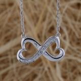 0.10 Carat (ctw) 14K White Gold Round White Diamond Ladies Double Heart Infinity Love Pendant 1/10 CT