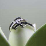 0.20 Carat (ctw) Sterling Silver Round & Baguette Cut Black & White Diamond Ladies Swirl Infinity Two Tone Wedding Ring 1/5 CT