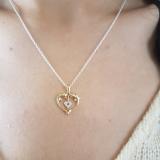 0.05 Carat (ctw) 10K Yellow Gold Real Round Diamond Ladies Double Dolphin Heart Pendant