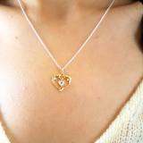 0.05 Carat (ctw) 18K Yellow Gold Real Round Diamond Ladies Double Dolphin Heart Pendant