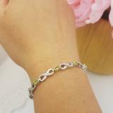2.38 Carat (ctw) Sterling Silver Real Oval Cut Peridot & Round Cut White Diamond Ladies Infinity Link Tennis Bracelet