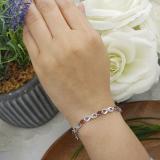 2.70 Carat (ctw) Sterling Silver Real Oval Cut Garnet & Round Cut White Diamond Ladies Infinity Link Tennis Bracelet