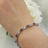 3.51 Carat (ctw) Sterling Silver Real Oval Cut Garnet & Round Cut White Diamond Ladies Infinity Link Tennis Bracelet