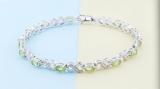 3.18 Carat (ctw) Sterling Silver Real Oval Cut Peridot & Round Cut White Diamond Ladies Infinity Link Tennis Bracelet