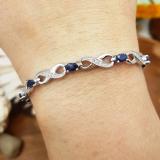 2.27 Carat (ctw) Sterling Silver Real Oval Cut Blue Sapphire & Round Cut White Diamond Ladies Infinity Link Tennis Bracelet