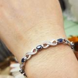 2.27 Carat (ctw) Sterling Silver Real Oval Cut Blue Sapphire & Round Cut White Diamond Ladies Infinity Link Tennis Bracelet