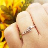 0.03 Carat (ctw) 10K White Gold Round Cut Diamond Ladies Bridal Bypass Solitaire Promise Ring