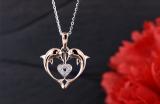 0.05 Carat (ctw) 10K Rose Gold Round White Diamond Ladies Heart Shape Double Dolphin Pendant
