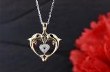 0.05 Carat (ctw) 18K Yellow Gold Round White Diamond Ladies Heart Shape Double Dolphin Pendant