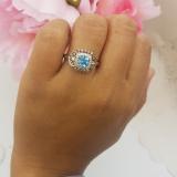 1.75 Carat (ctw) 10K Rose Gold Cushion Cut Blue Topaz & Round Cut Champagne & White Diamond Ladies Halo Style Bridal Engagement Ring