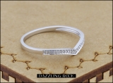 0.08 Carat (ctw) 10K White Gold Round White Diamond Ladies Wedding Stackable Band Anniversary Guard Chevron Ring
