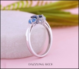 1.65 Carat (ctw) Sterling Silver Center Oval Cut London Blue Topaz & Side Heart Cut Swiss Blue Topaz & Round Cut White Diamond Ladies 3 Stone Bridal Engagement Ring