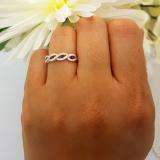 0.28 Carat (ctw) 10K White Gold Round Blue Sapphire & White Diamond Ladies Bridal Stackable Anniversary Wedding Band Swirl Ring 1/4 CT