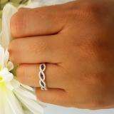 0.28 Carat (ctw) 10K White Gold Round Blue Sapphire & White Diamond Ladies Bridal Stackable Anniversary Wedding Band Swirl Ring 1/4 CT