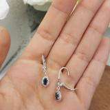 0.80 Carat (ctw) 10K White Gold Oval Cut Blue Sapphire & Round Cut White Diamond Ladies Halo Style Dangling Drop Earrings 3/4 CT
