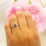 0.70 Carat (ctw) 10K White Gold Oval Cut Blue Sapphire & Round White Diamond Ladies Bridal Halo Engagement Ring 3/4 CT