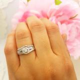 0.40 Carat (ctw) 10K White Gold Round & Baguette Cut White Diamond Ladies Swirl Engagement Ring With Matching Band Set