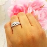 0.40 Carat (ctw) 10K White Gold Round & Baguette Cut White Diamond Ladies Swirl Engagement Ring With Matching Band Set