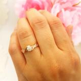 0.25 Carat (ctw) 14K Rose Gold Round & Baguette Cut White Diamond Bridal Cluster Flower Engagement Ring 1/4 CT