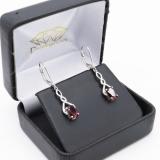 2.10 Carat (Ctw) Sterling Silver Oval Cut Garnet & Round Cut White Diamond Ladies Infinity Swirl Dangling Drop Earrings