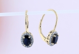 1.17 Carat (ctw) 14K Yellow Gold Oval Cut Blue Sapphire & Round Diamond Ladies Dangling Earrings