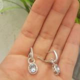 18K White Gold 7X5 MM Oval Cut Blue Topaz & Round Cut White Diamond Ladies Dangling Earrings