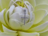 0.06 Carat (ctw) 10K White Gold Round Diamond Ladies Cross Pendant (Silver Chain Included)