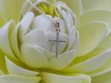 0.06 Carat (ctw) 10K Yellow Gold Round Diamond Ladies Cross Pendant (Silver Chain Included)