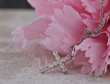 0.15 Carat (ctw) 10K Rose Gold Round Diamond Ladies Cross Pendant (Silver Chain Included)