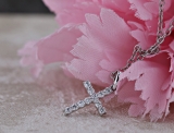 0.15 Carat (ctw) 10K White Gold Round Diamond Ladies Cross Pendant (Silver Chain Included)