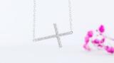 0.06 Carat (ctw) Sterling Silver Round Diamond Sideways Religious Cross Ladies Pendant