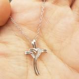 0.10 Carat (ctw) 10K White Gold Round Diamond Ladies Cross Heart Pendant 1/10 CT (Silver Chain)